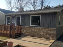 Installed Mastic Board & Batten Vertical Vinyl Siding, Thermo-Tech Full-Frame Replacement Windows, Ledgestone Versetta Accent Stone in Plover, WI