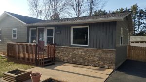 Installed Mastic Board & Batten Vertical Vinyl Siding, Thermo-Tech Full-Frame Replacement Windows, Ledgestone Versetta Accent Stone in Plover, WI